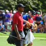 Tiger Woods approaches East Lake's fifth green with caddie Joe LaCava.