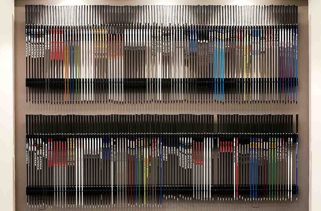 True Spec wall of golf shafts