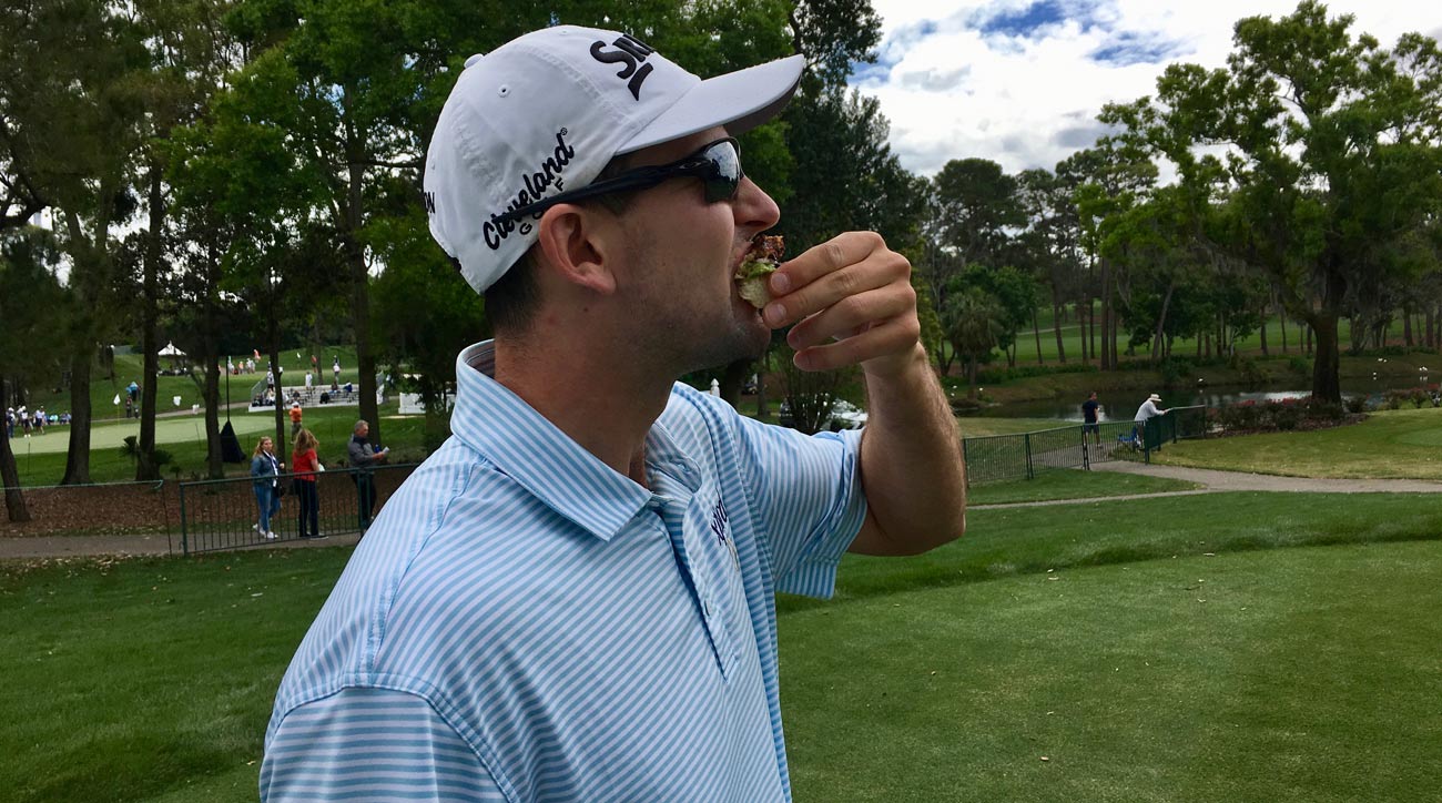 Martin Trainer chows down on a crabcake avocado open-faced slider &ndash; a big-time win.