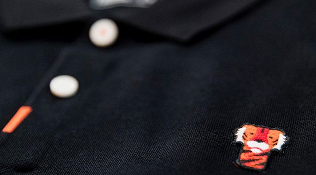 Tiger Woods wore a custom Nike shirt on Tuesday with a logo of his headcover.