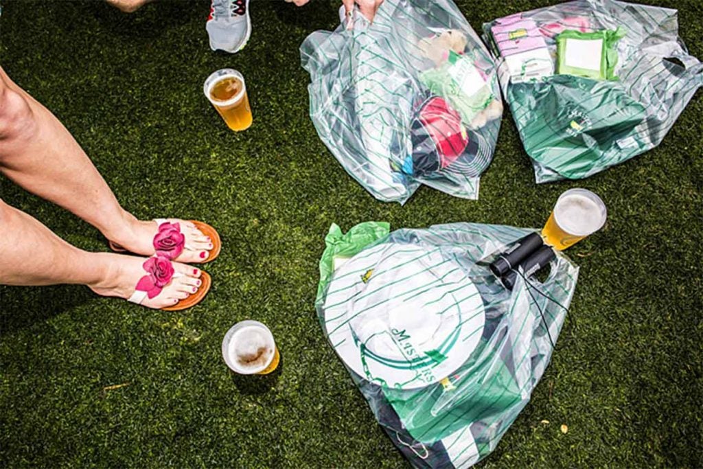 Masters patrons with Masters merchandise.