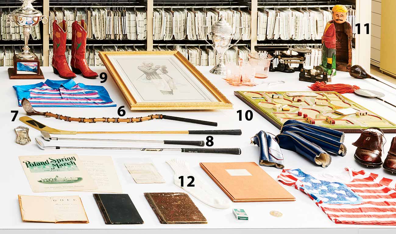 Above: 6. Sectional driver designed by trick-shot maestro Joe Kirkwood; 7. Modified putter from  Happy Gilmore; 8. Club used on Mt. Everest by Robert C. Vaughn to break the record for a golf shot hit from the highest elevation; 9. LPGA Tour winner Barbara Romack&rsquo;s Ralph Lauren cowboy boots; 10. Gibbs Golf board game (ca. 1930); 11. Prohibition-era figurine used to hide liquor bottles (ca. 1920); 12. Sock used by Alan Shepard in 1971 to hold the golf club head used for his Apollo 14 moon shot.
