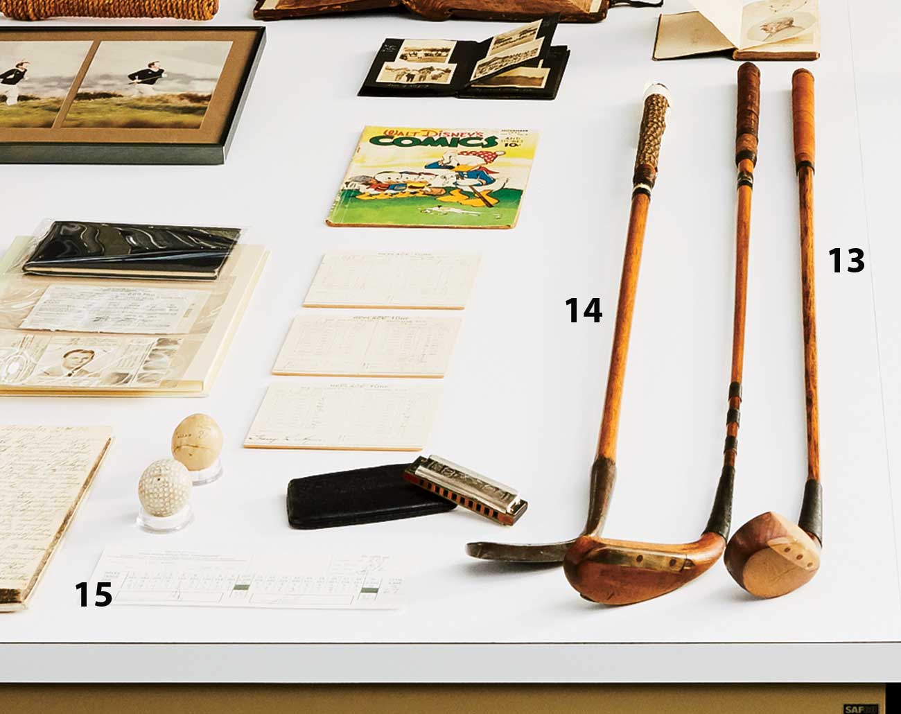 Above: 13. Wood used by FDR (ca. 1915); 14. Vintage sand iron (ca. 1780); 15. Final-round scorecard from Tiger Woods&rsquo;s record-shattering 2000 U.S. Open victory at Pebble Beach.
