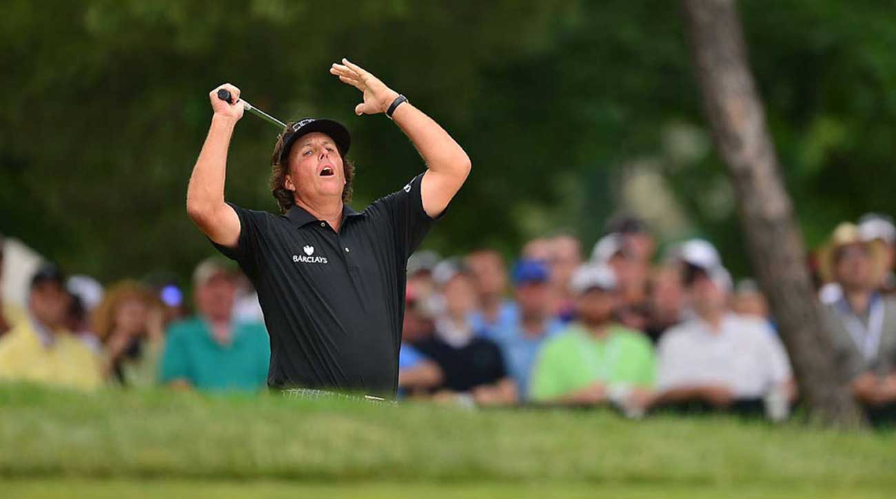 Phil Mickelson hits out of a bunker at the 2013 U.S. Open.