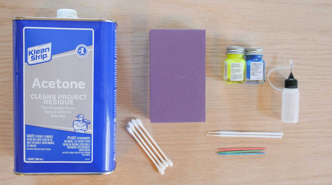 Supplies you need: Acetone/paint remover, model paint, small brushes or needle-paint droppers, sanding block (optional) and cotton swabs. 