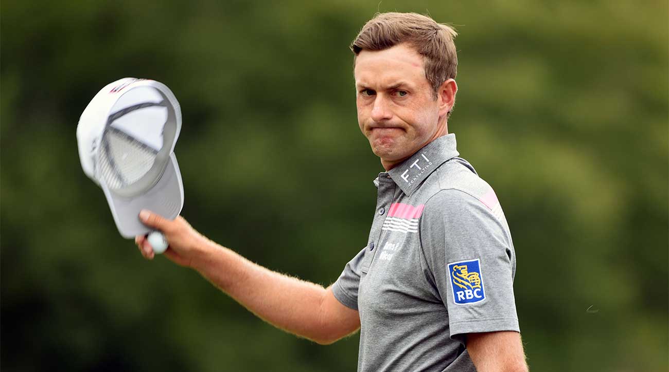 Webb Simpson waves to the crowd on Sunday at the Wyndham.