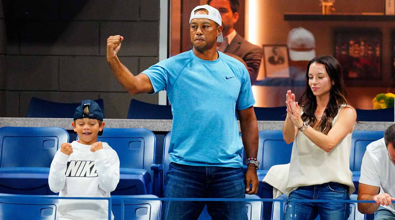 Tiger Woods with son Charlie (left) and girlfriend Erica Herman at the U.S. Open on Wednesday.