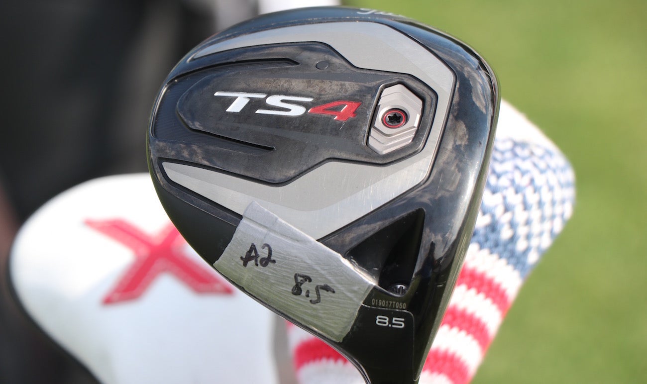 Scott Piercy applies lead tape to the heel portion of his driver for added draw-bias. 