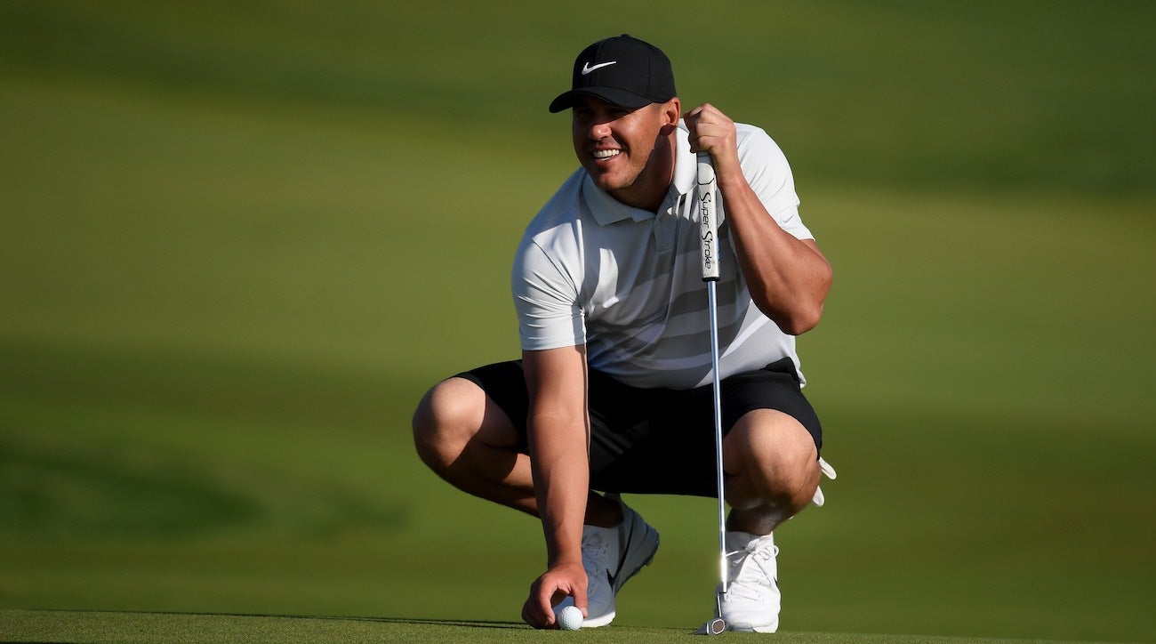 Brooks Koepka with his new putter in Saudi Arabia.