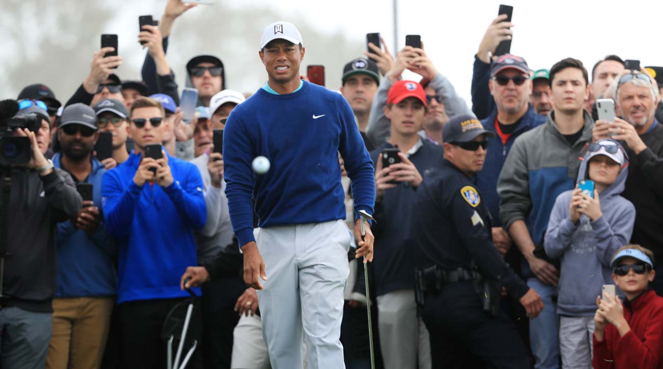 Tiger Woods watches a chip during the third round of the 2020 Farmers Insurance Open