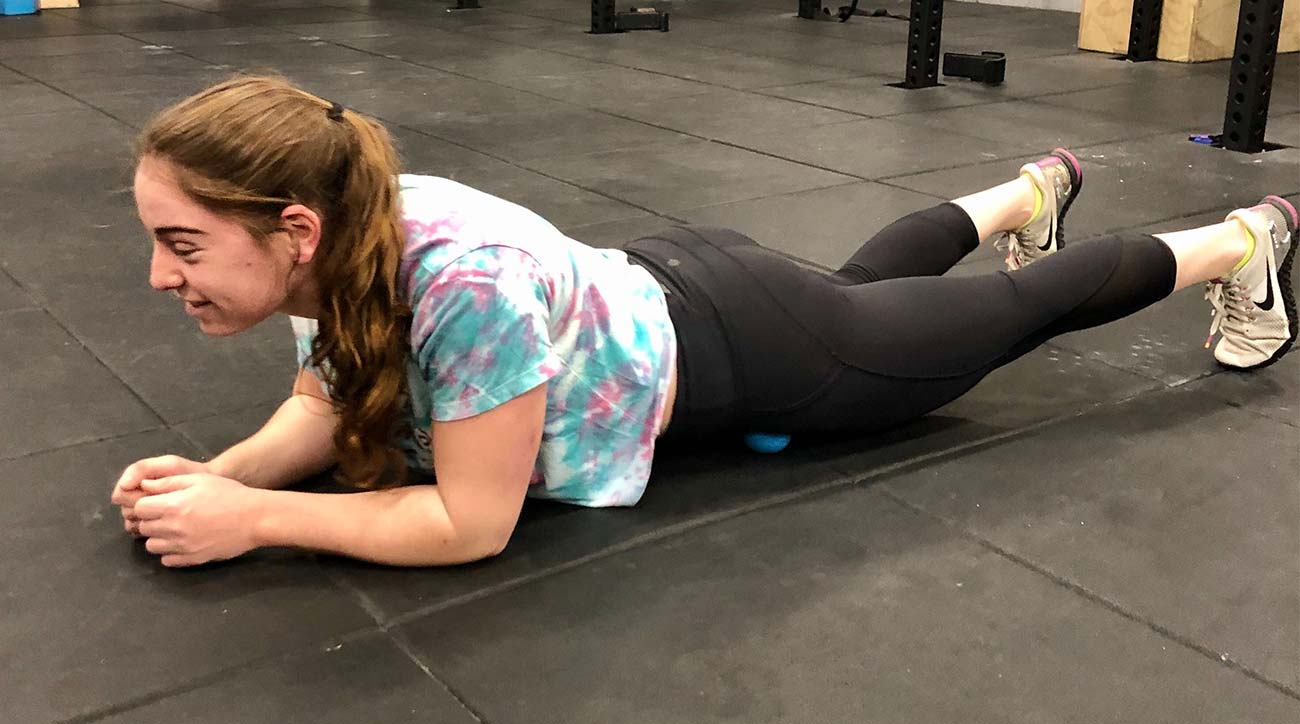 Rolling out your hips with a lacrosse ball will give you more flexibility to turn throughout your swing. 