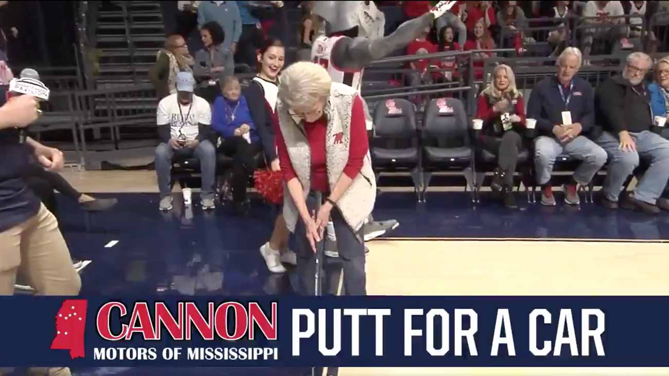 Mary Ann Mary Ann Wakefield sets up for her car-winning putt Saturday.