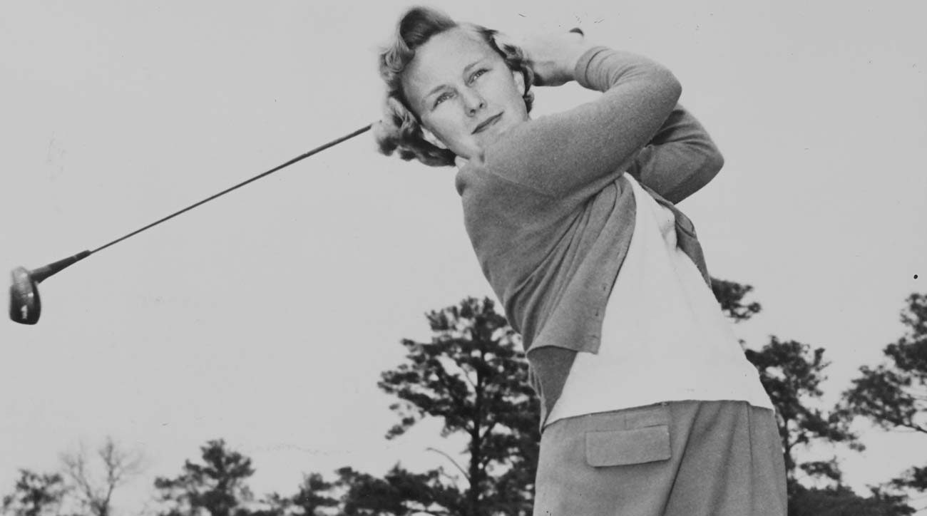 Mickey Wright swings a golf club.