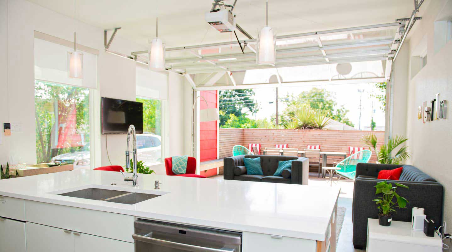 Airy living room, kitchen, and patio of a Texas home