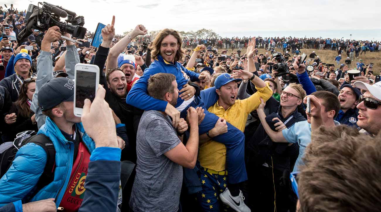 Fans carry pro Tommy Fleetwood after Europe's victory at the 2018 Ryder Cup.