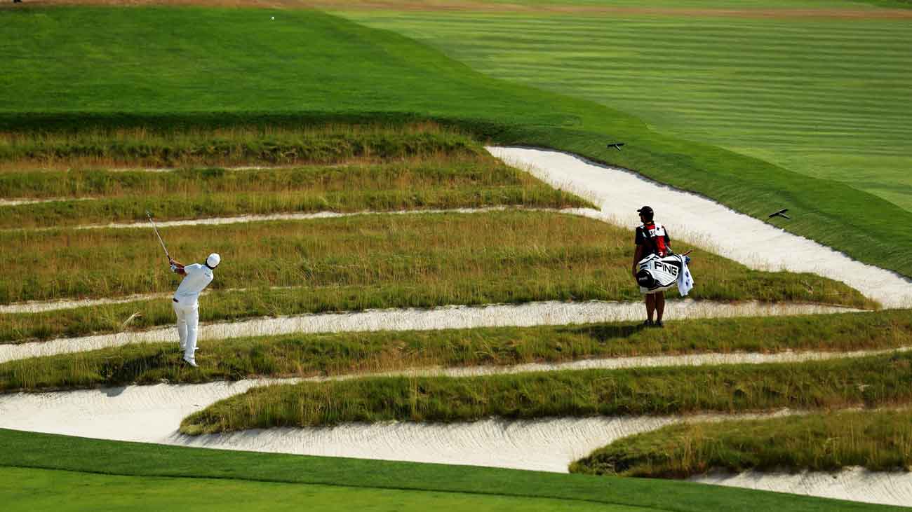 Andrew Landry plays a shot from the church pew bunkers on the 609-yard, par-5 fourth hole during the 2016 U.S. Open.