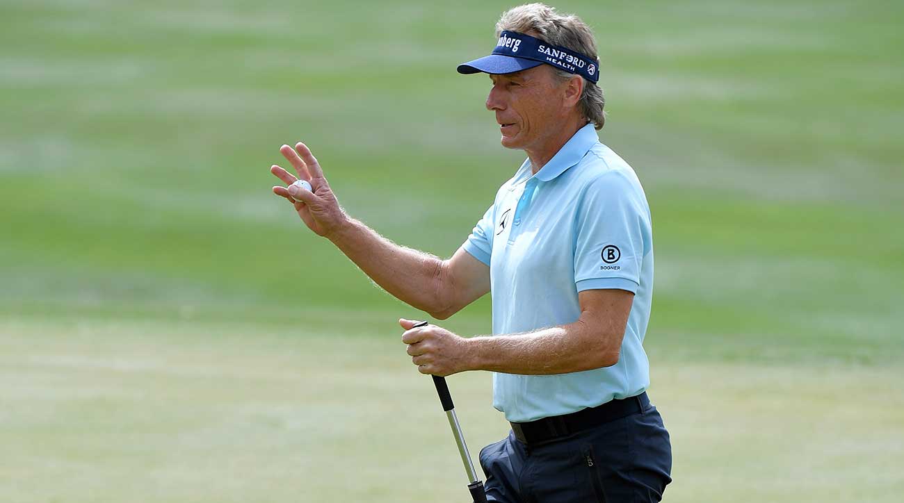 Bernhard Langer waves to the crowd.