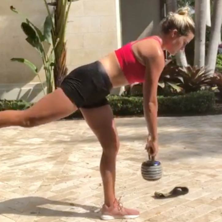 Lexi Thompson demonstrates a single leg deadlift using a kettlebell.