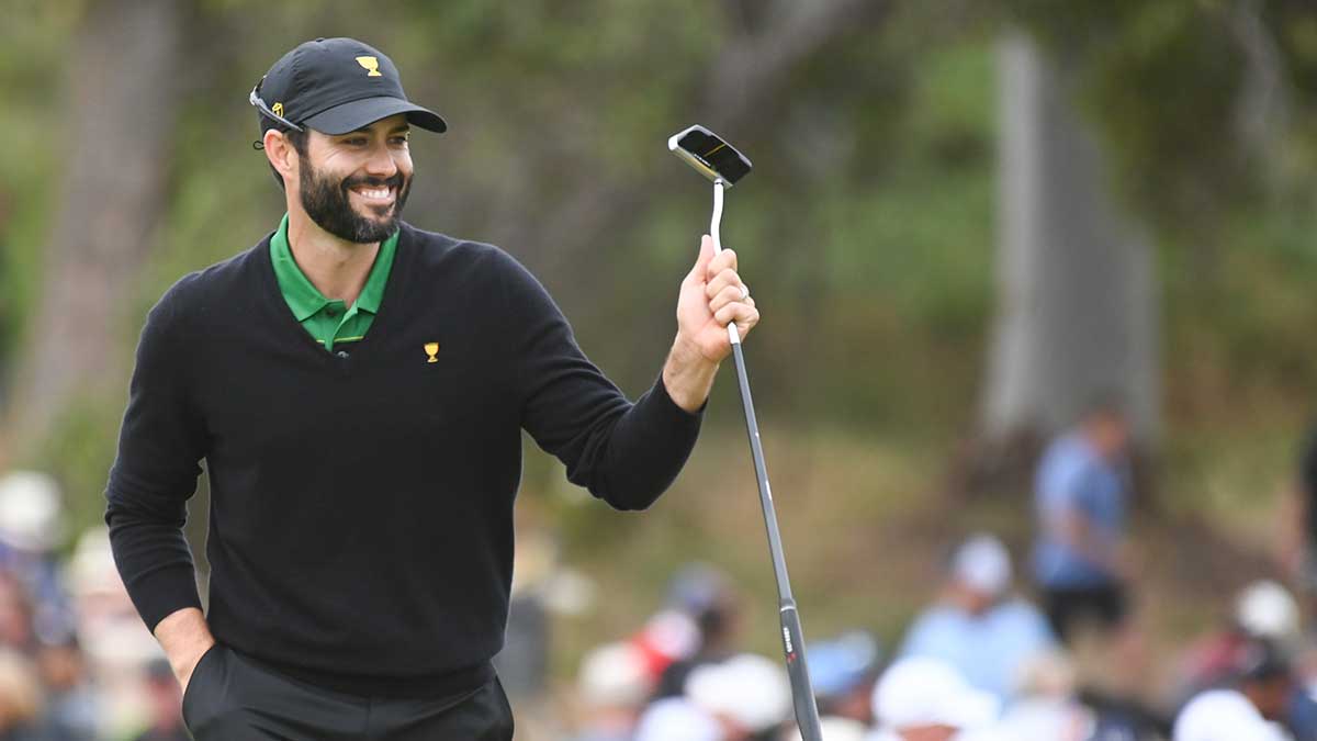 Adam Hadwin lifts his putter.