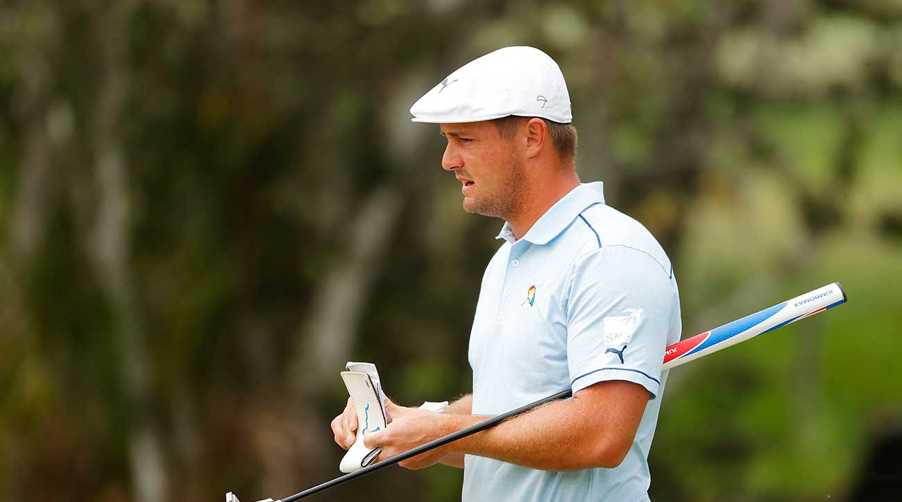 Bryson Dechambeau holds putter