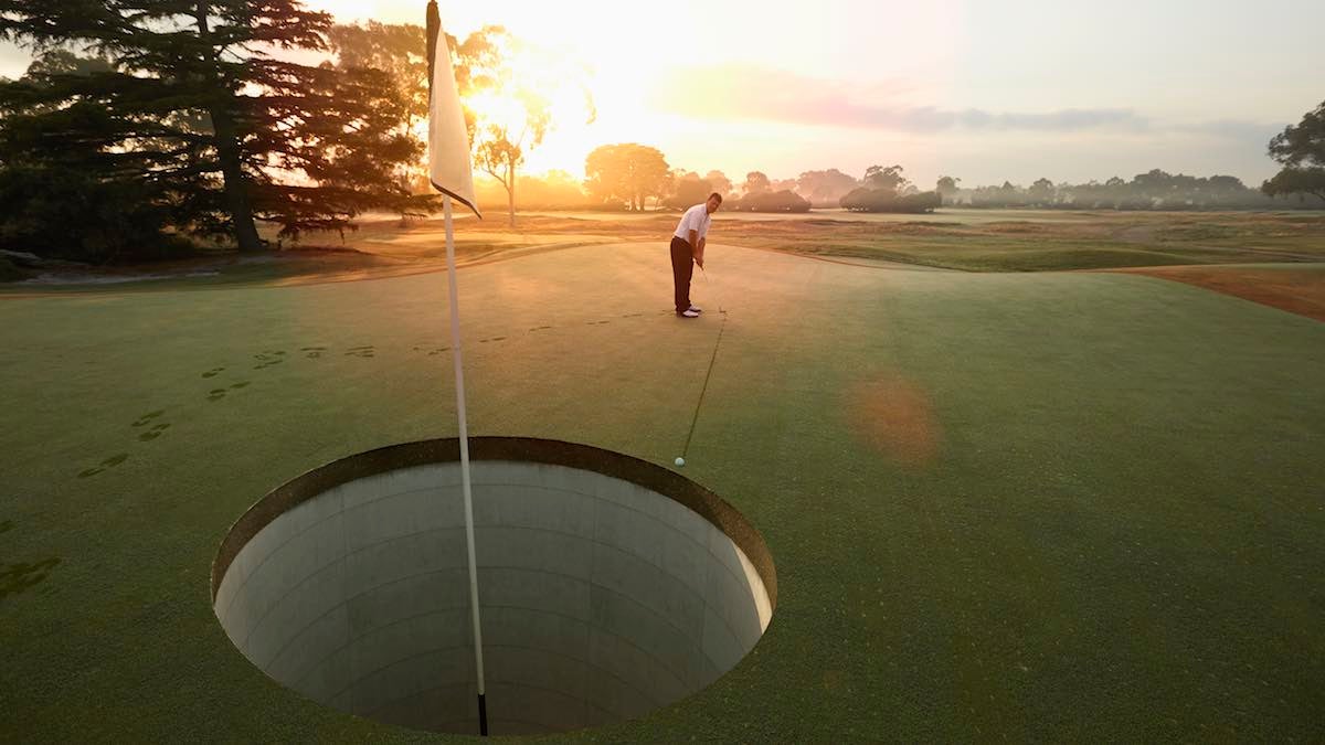 man playing golf on course