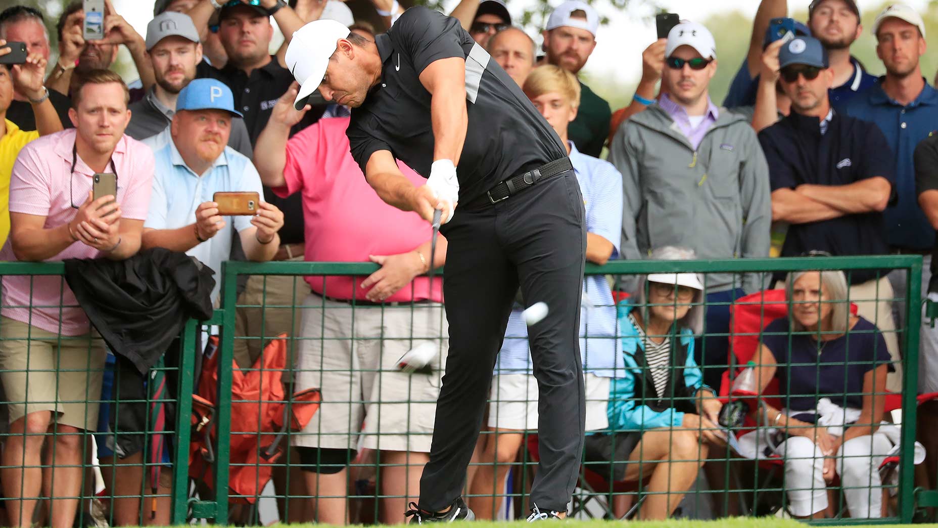 Brooks Koepka hits driver off the tee.