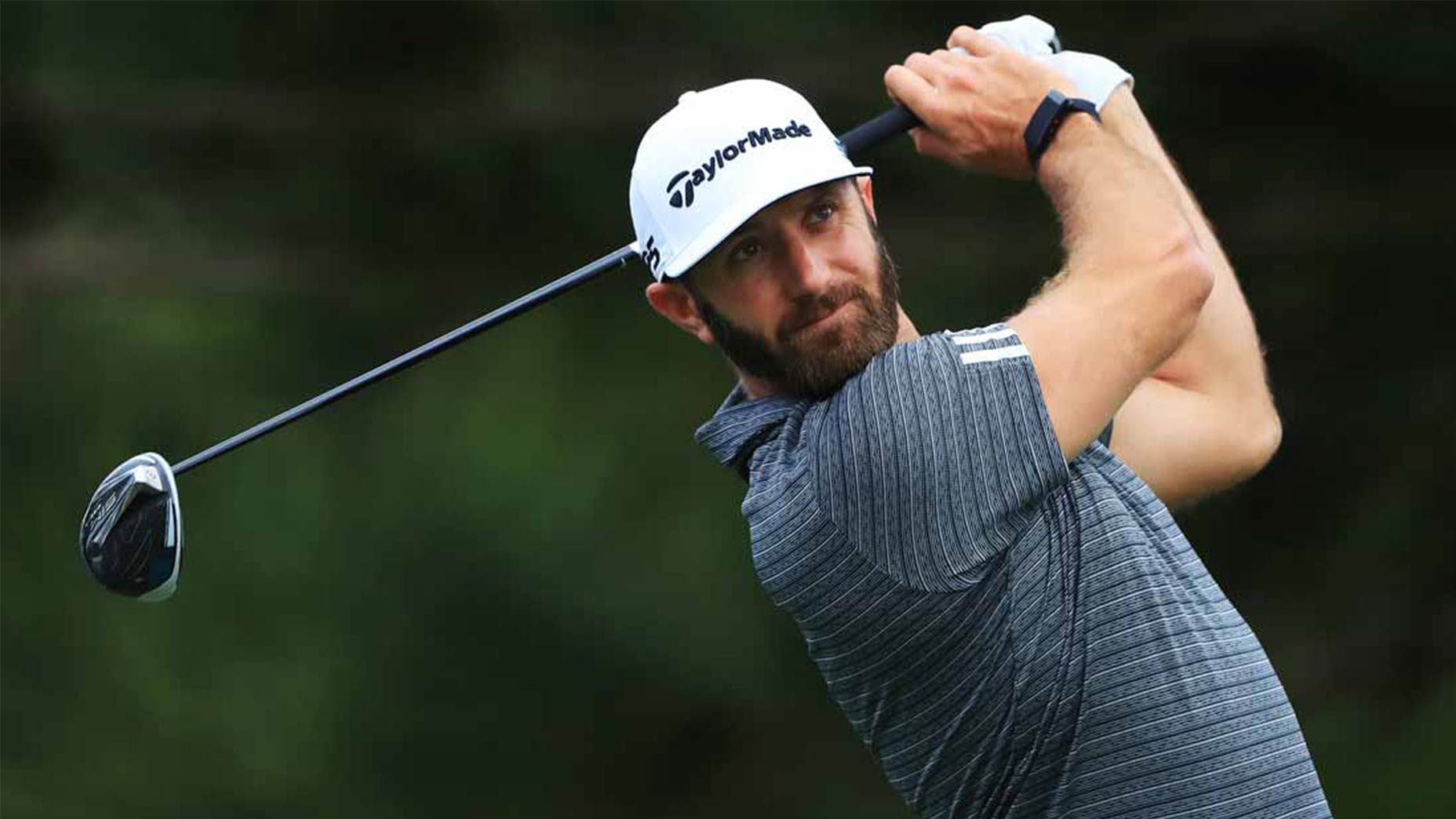 Dustin Johnson hits a drive.