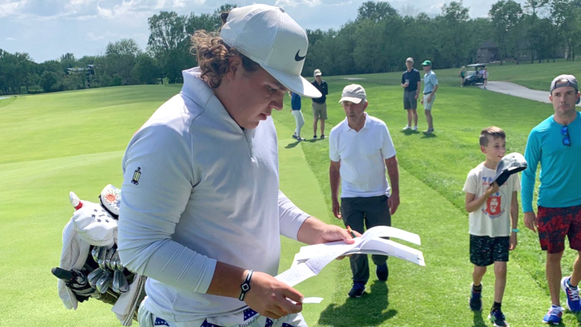 John Daly Jr. walks off golf green