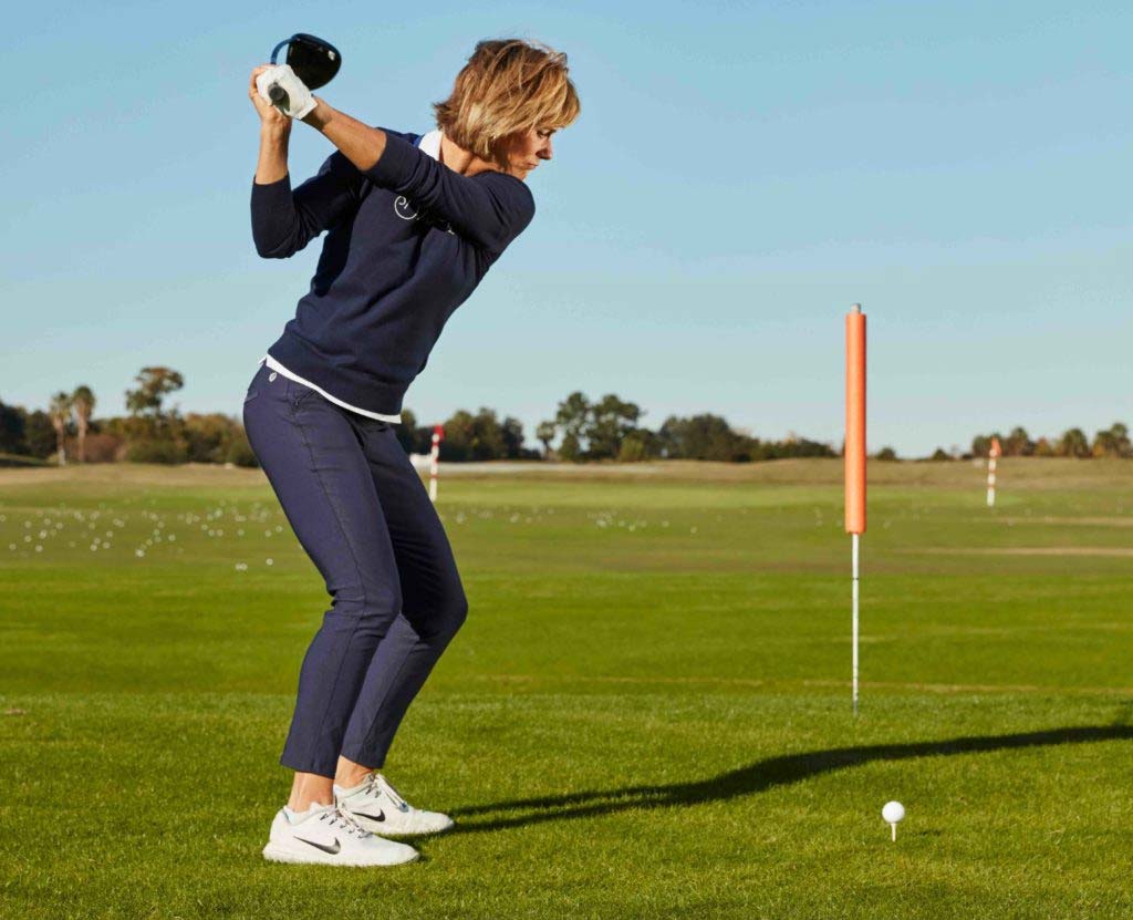 Golf instructor performing drill