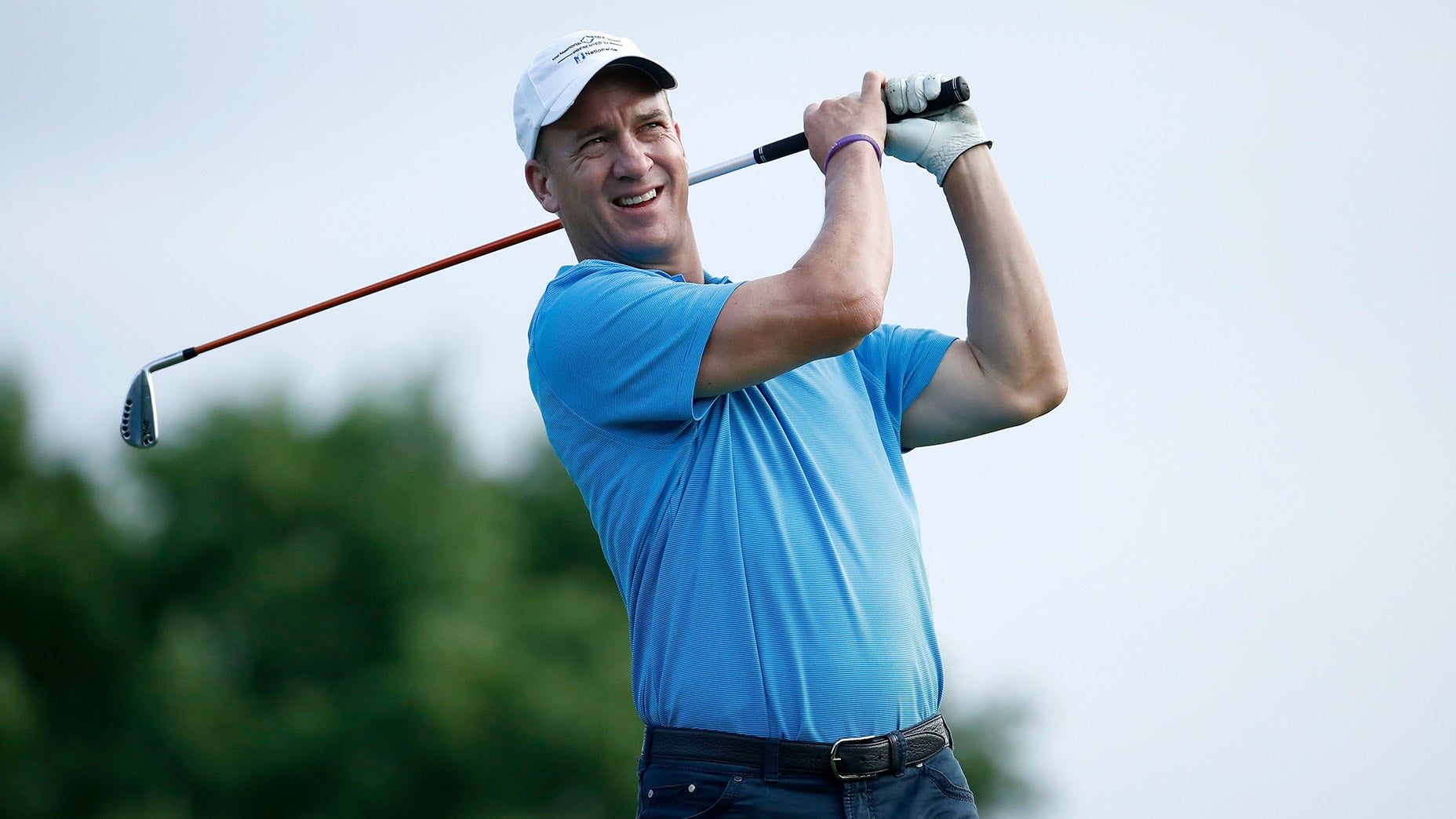 Peyton Manning hits a shot.