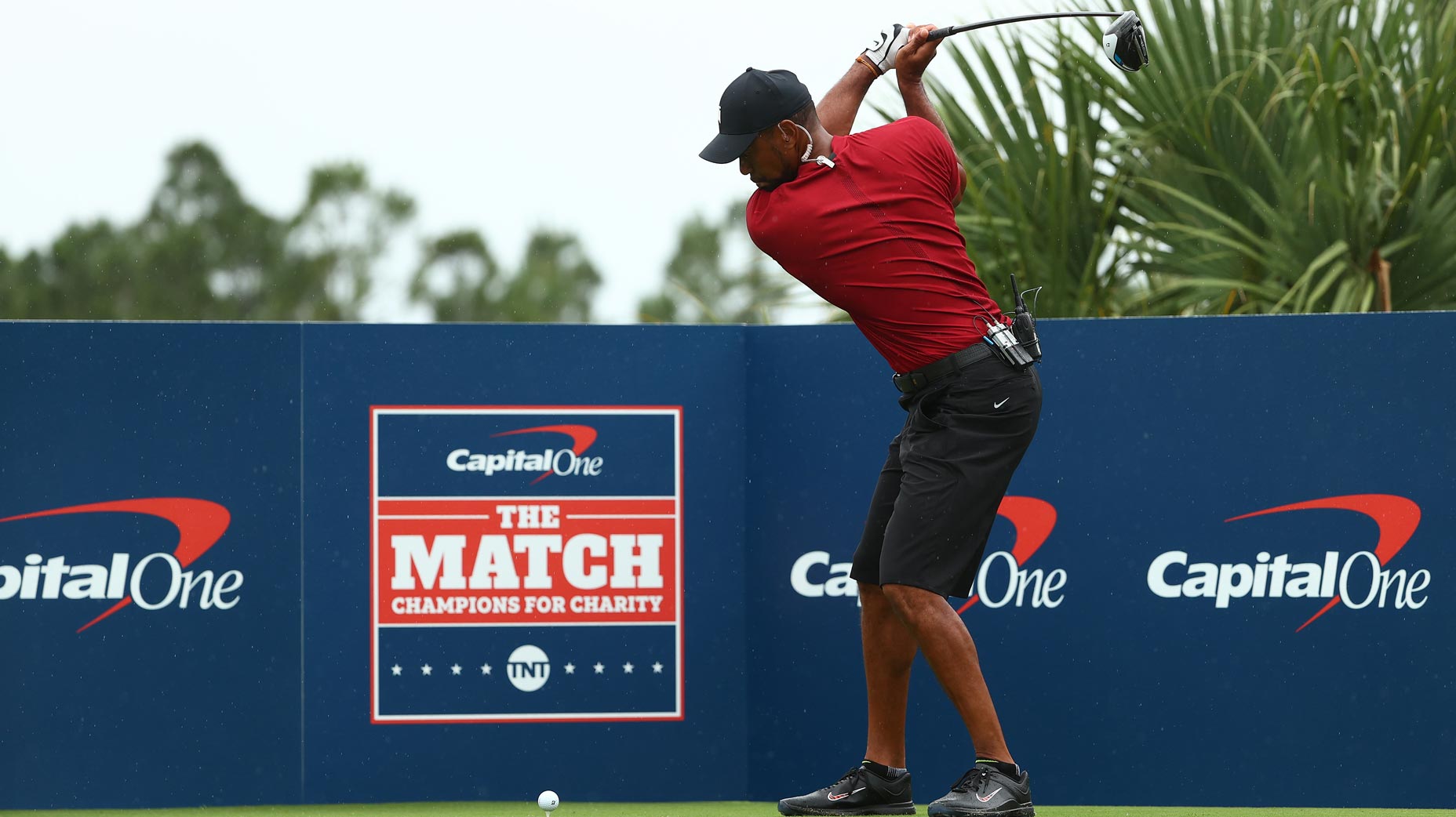 tiger woods hits tee shot during the match ii