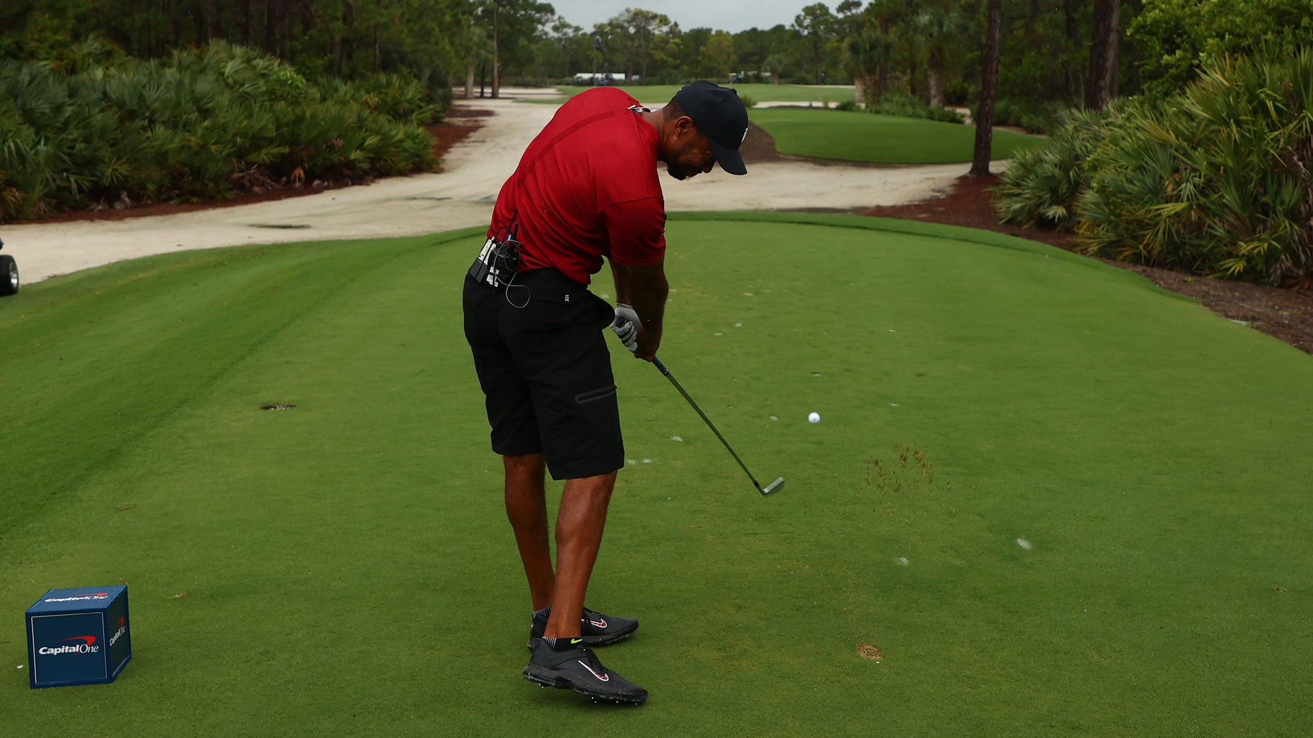 Tiger Woods tees off on the 11th hole at Medalist Golf Club.
