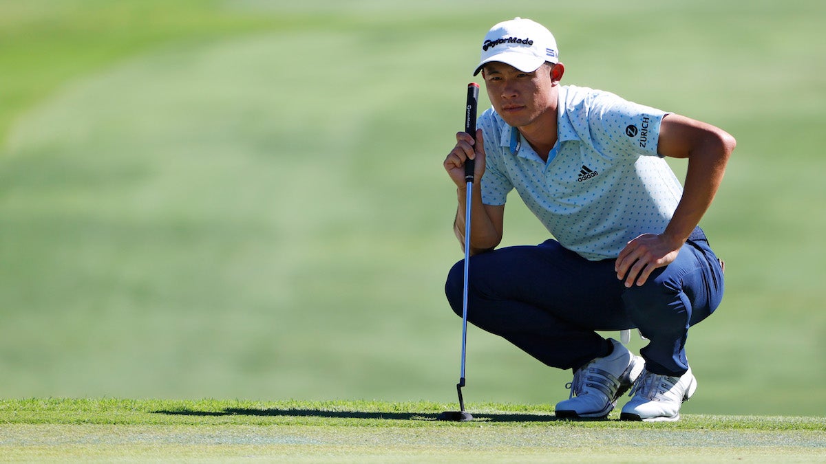 Pro golfer Collin Morikawa reads putt