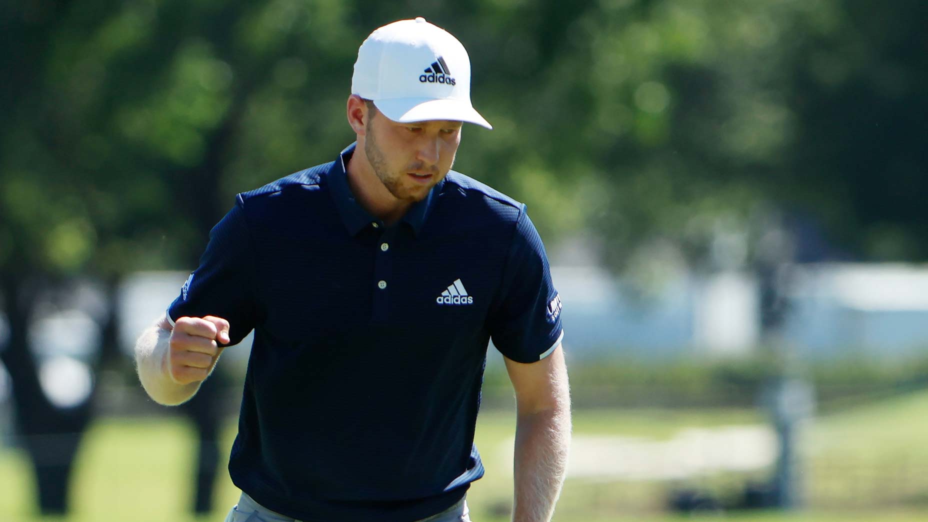 Daniel Berger pumps his fist after making a putt on Sunday.