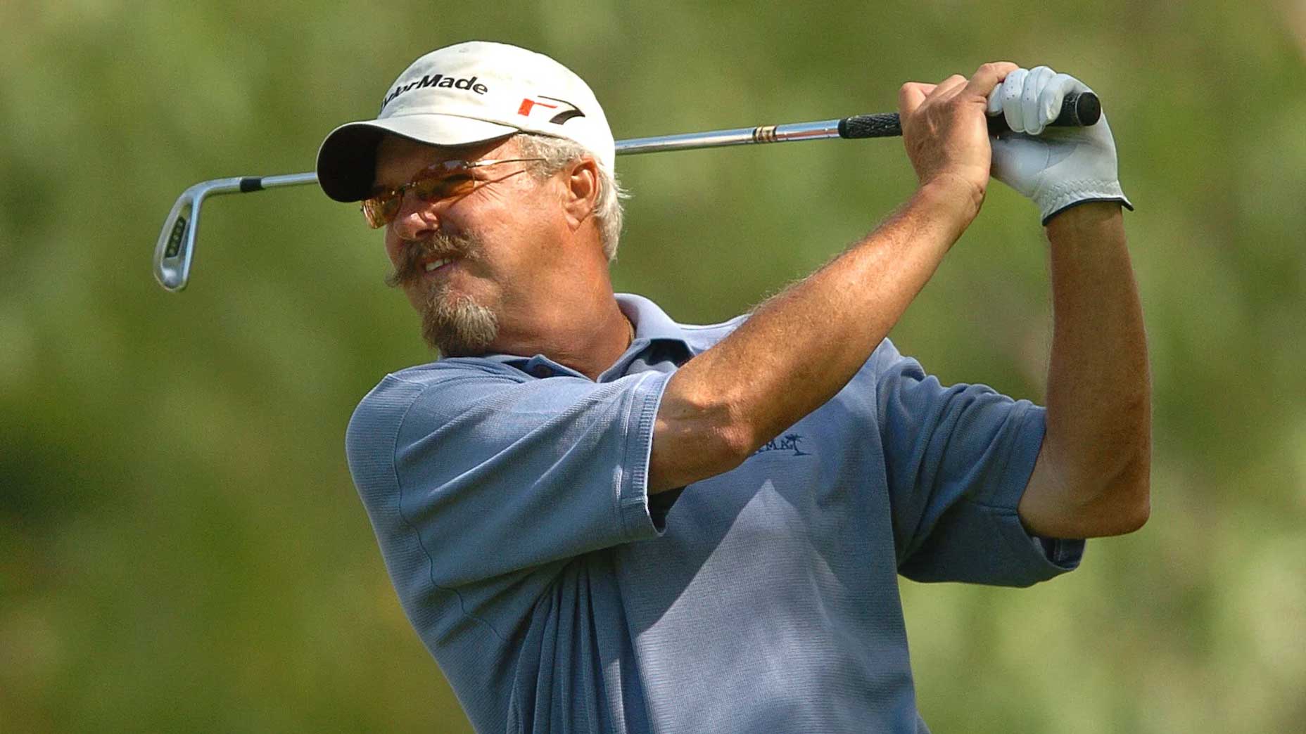 Gary McCord hits a golf shot.