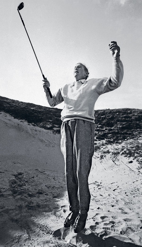 Fleming, the author of 14 Bond books, tries to get a good look out of a bunker.