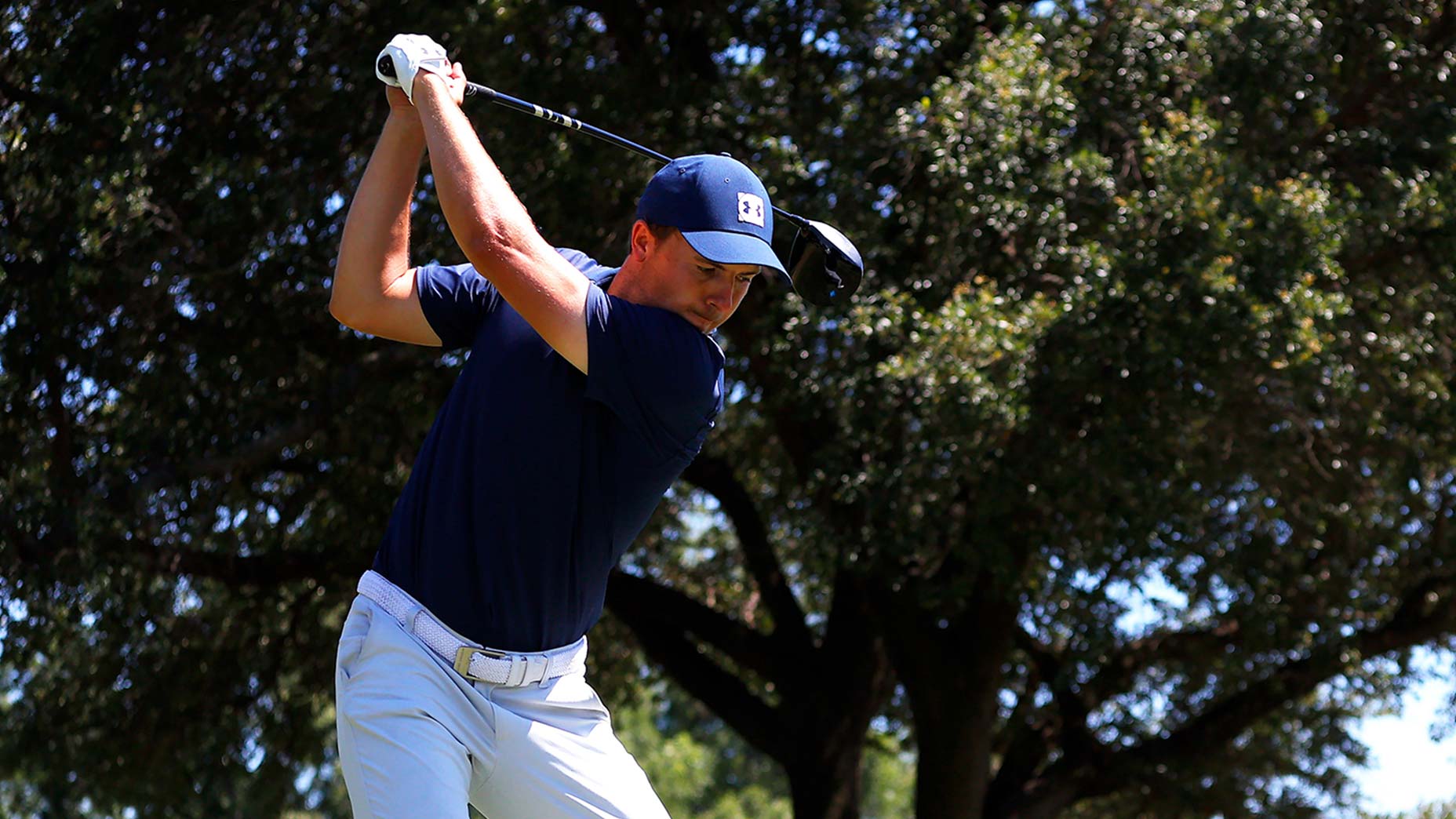 Jordan Spieth hits a tee shot at Colonial.