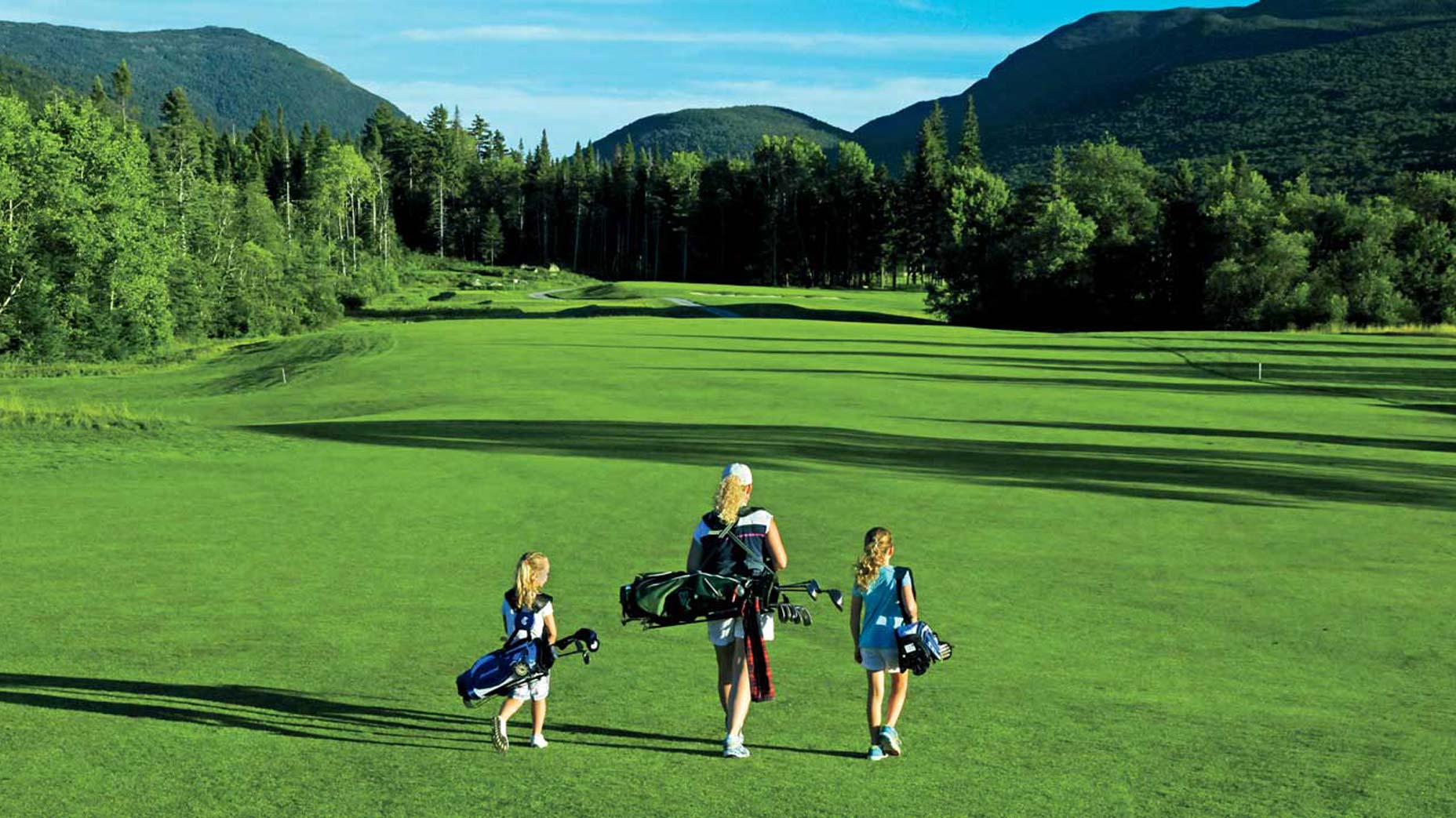 family walks on golf course