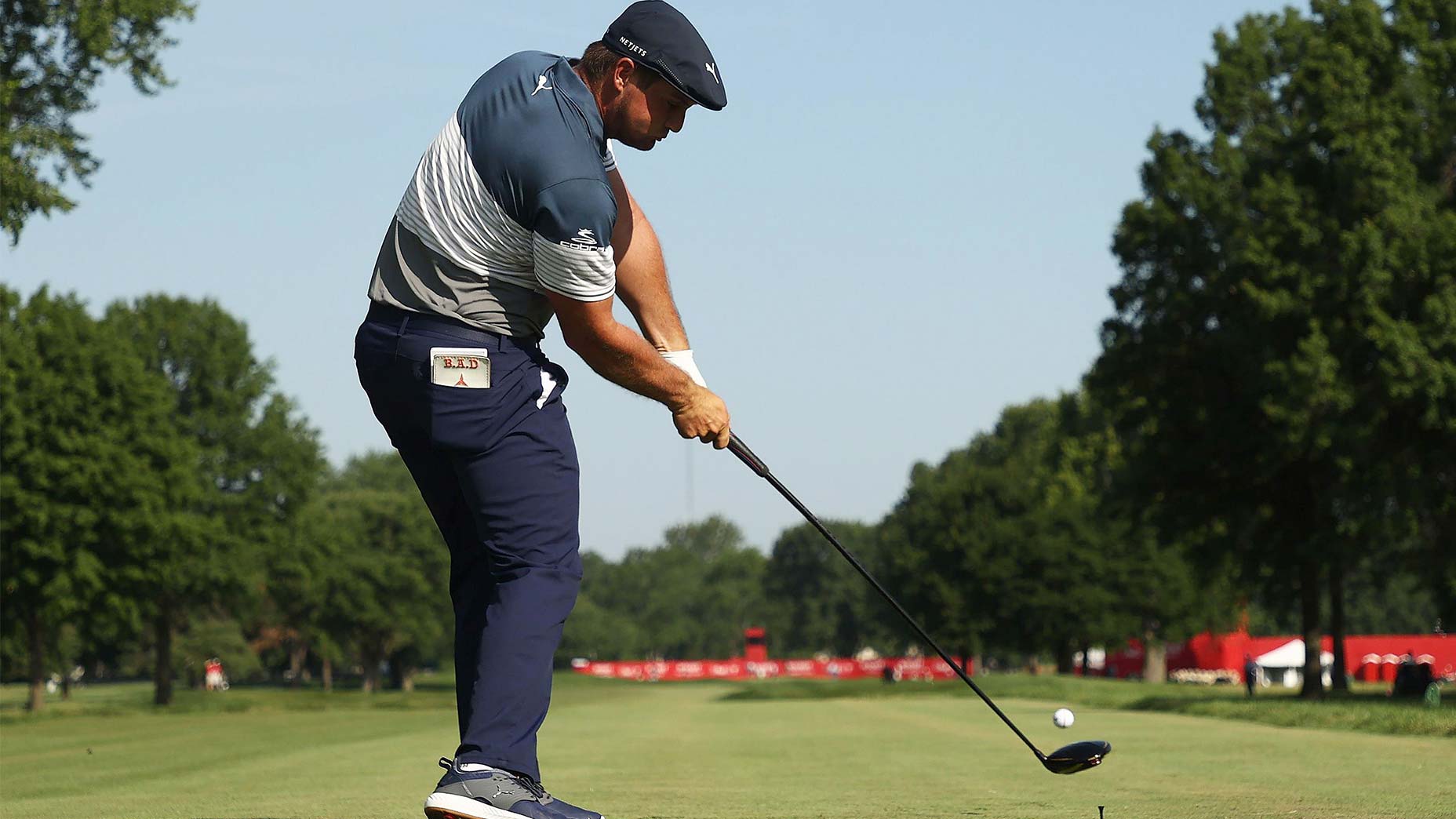 Bryson DeChambeau hits a drive down the fairway.