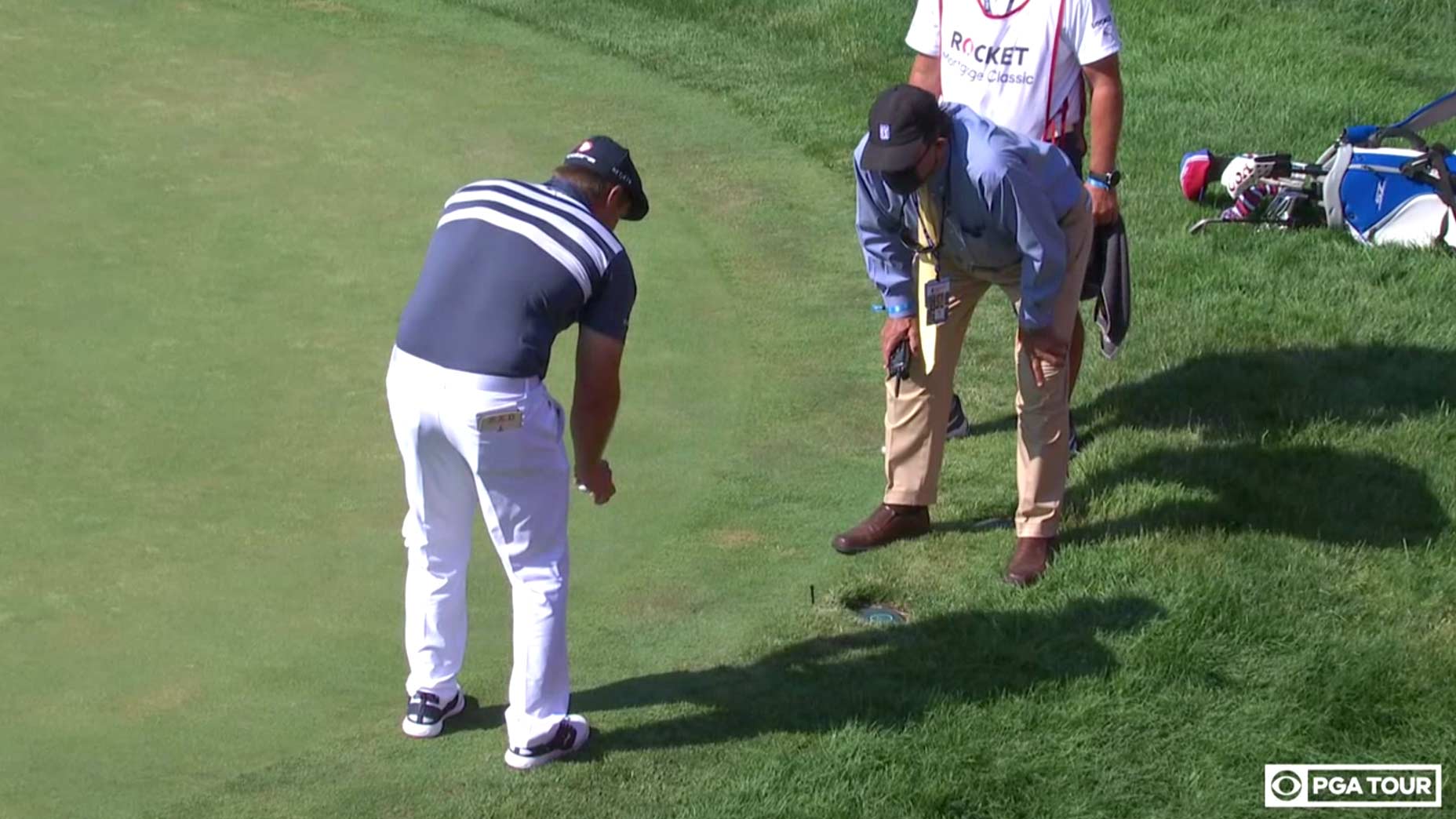 Bryson DeChambeau takes a drop at the Rocket Mortgage Classic.