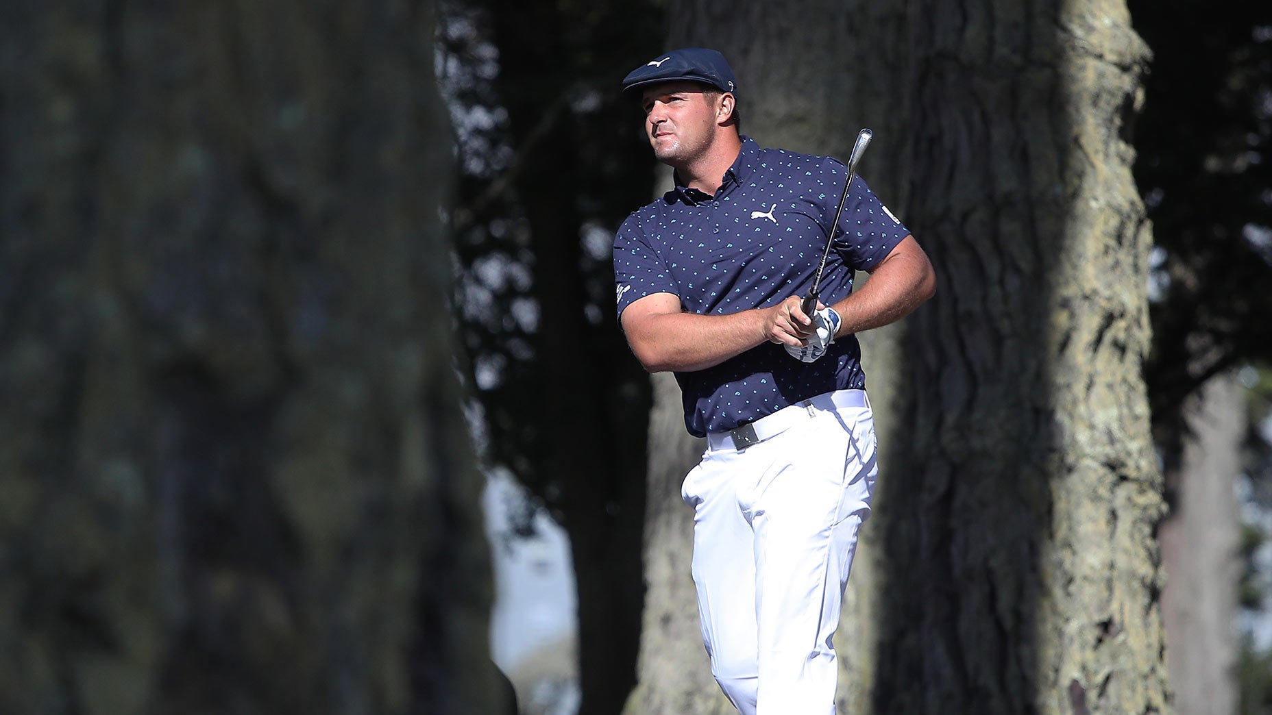 Bryson DeChambeau watches a shot.