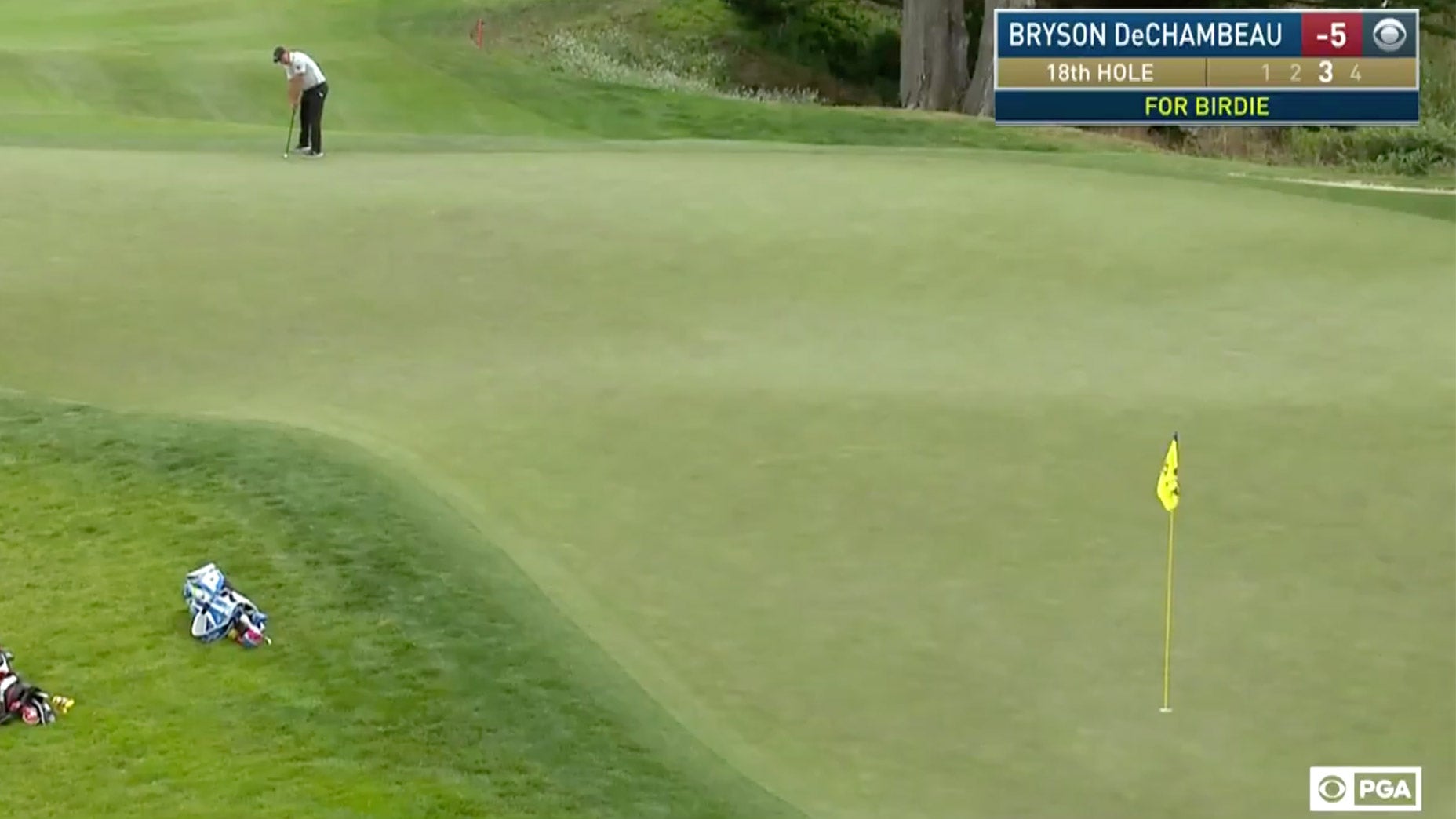 Bryson Dechambeau makes a putt.