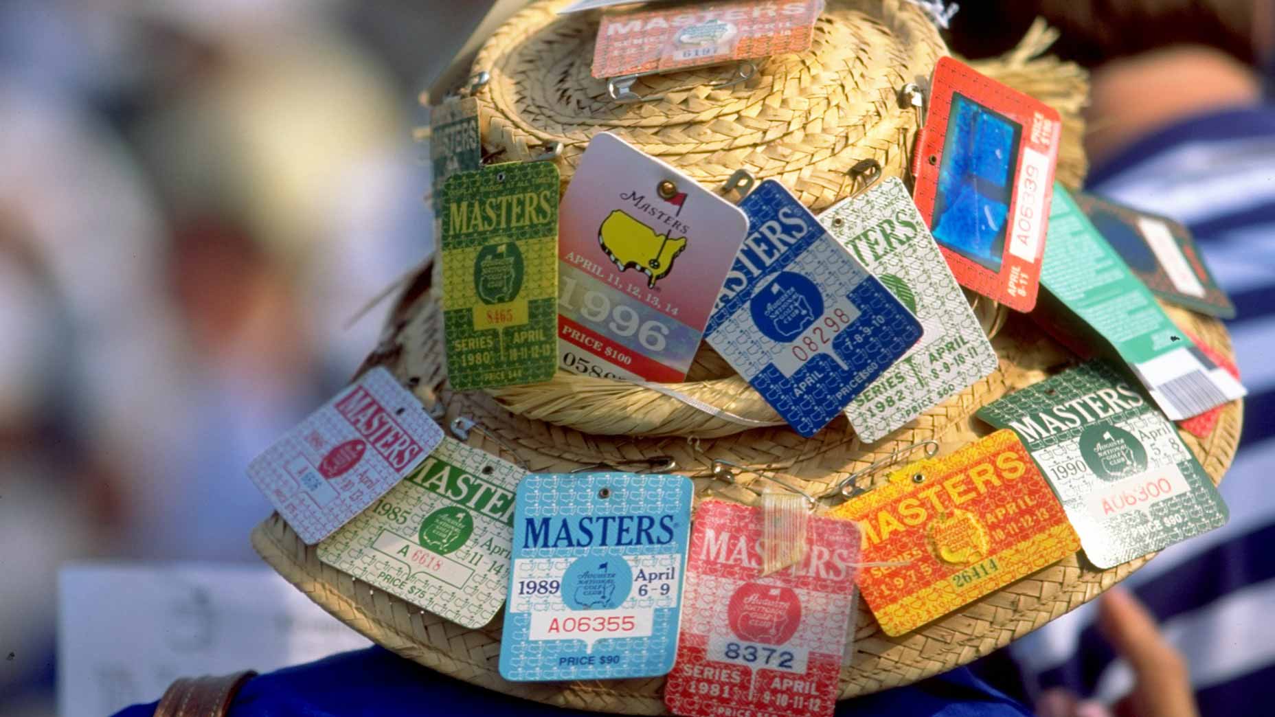 Masters fan with masters tickets on hat