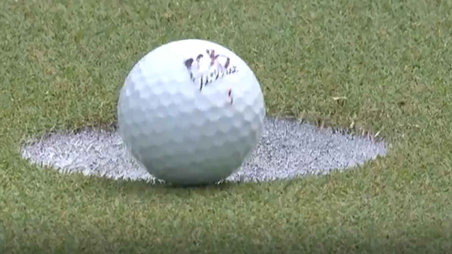 Rafael Cabrera-Bello's golf ball sits on edge of cup