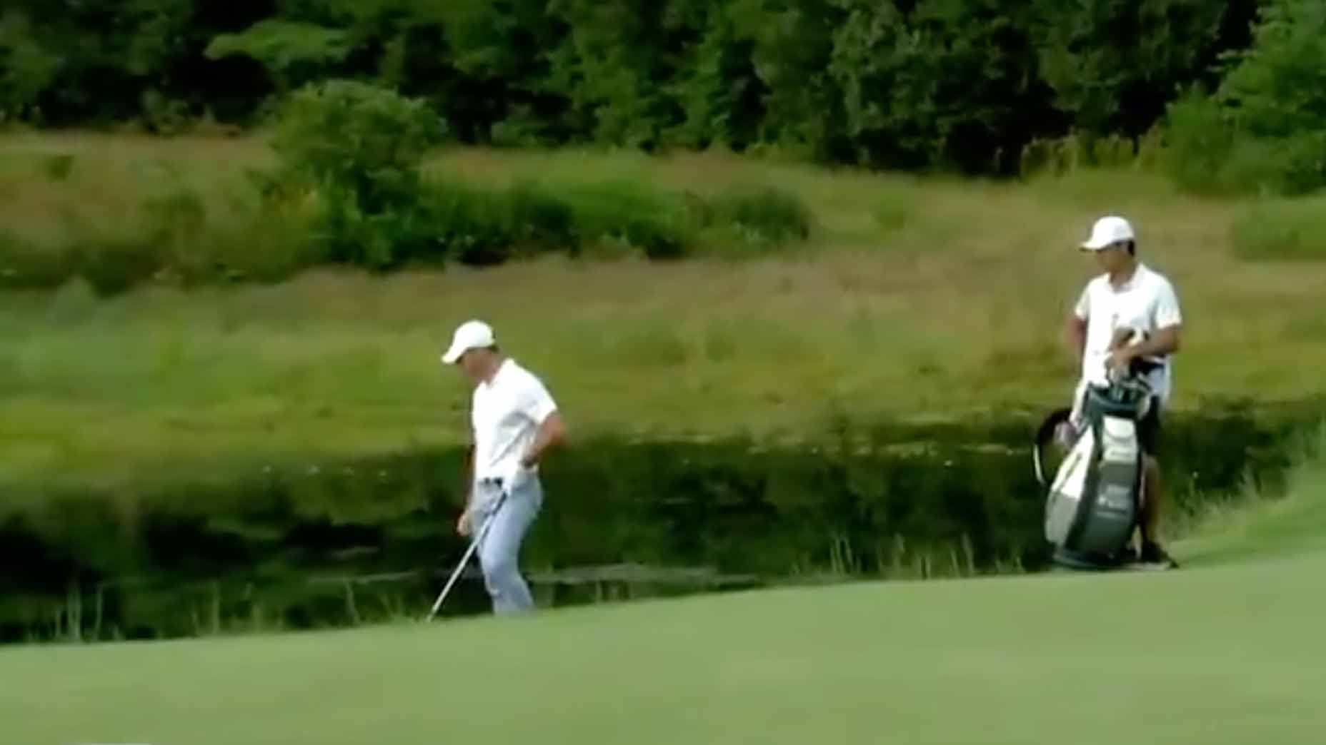 rory mcilroy looks at ball