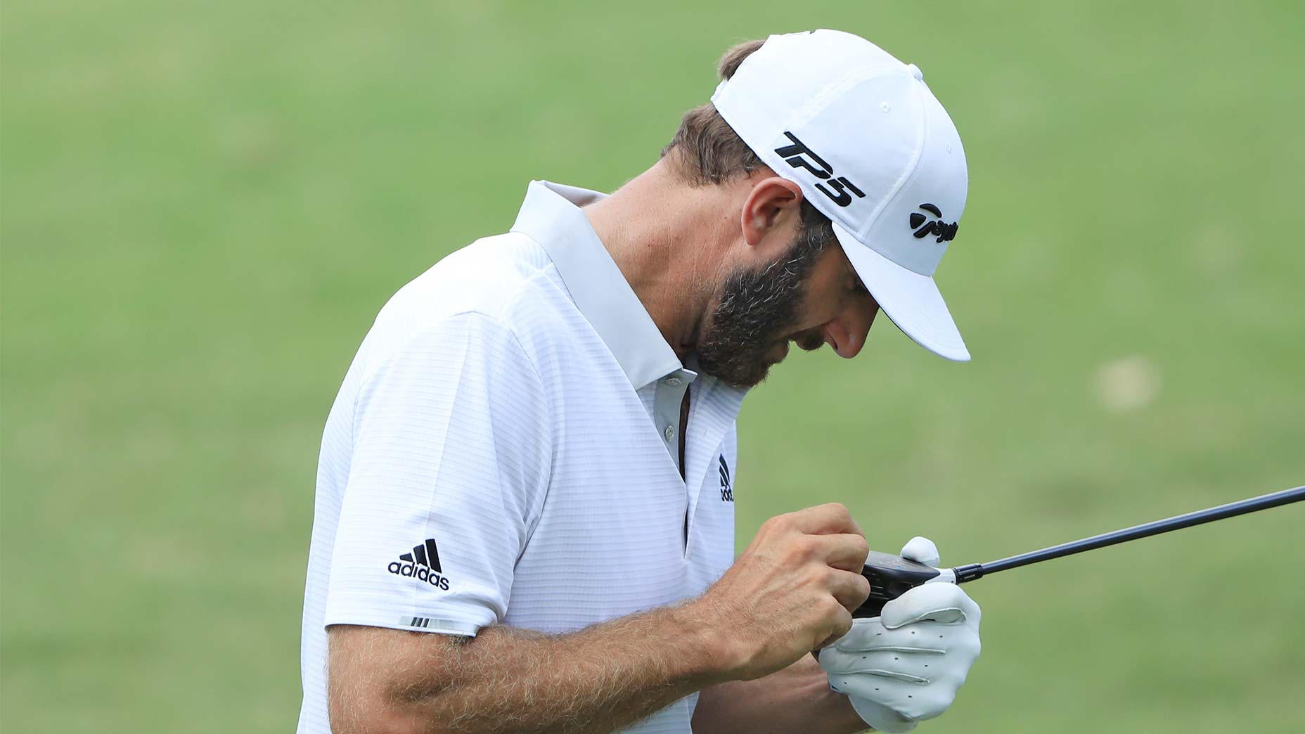 dustin johnson cleans fairway wood