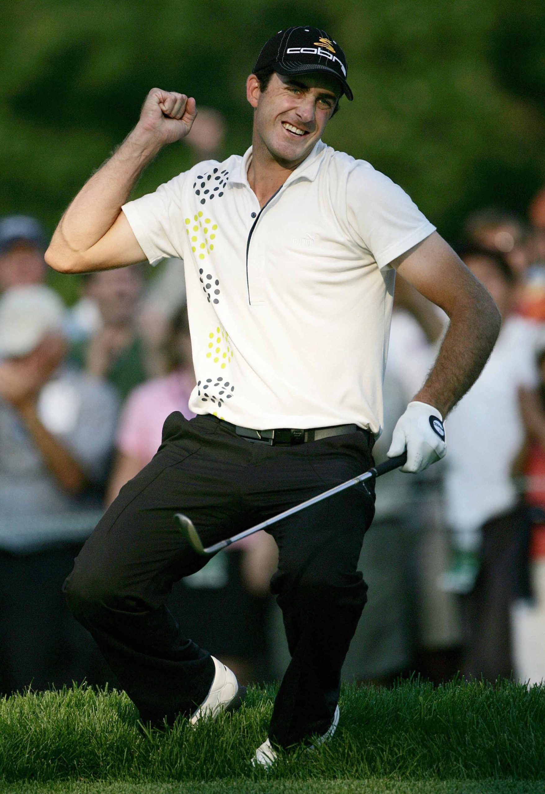Geoff Ogilvy celebrates a putt.