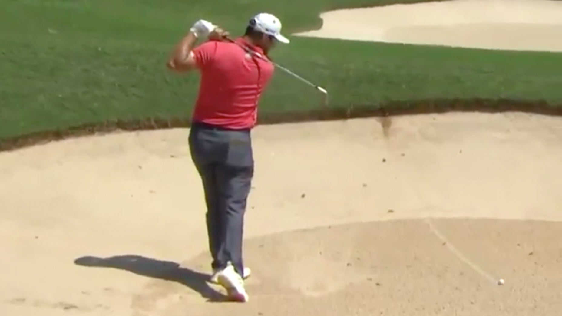 jon rahm stares at backward shot