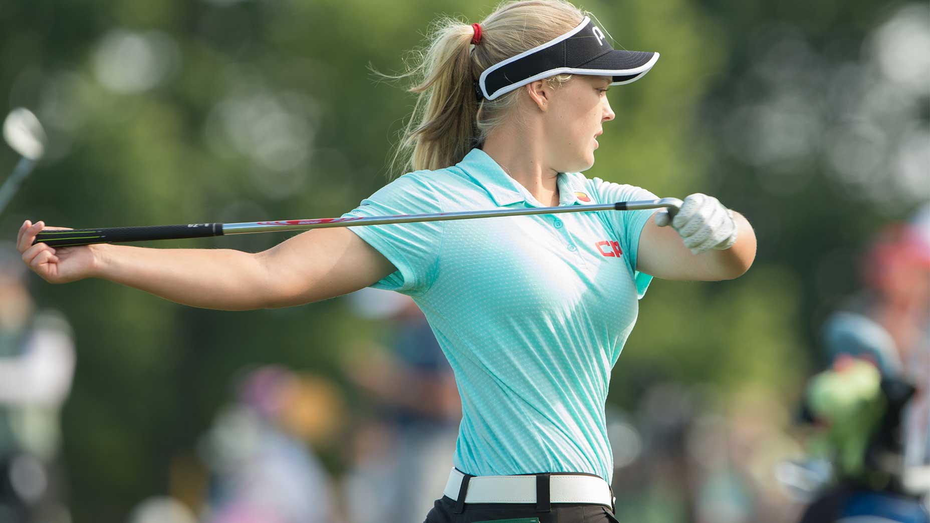 Brooke Henderson goes through her pre-round mobility routine.