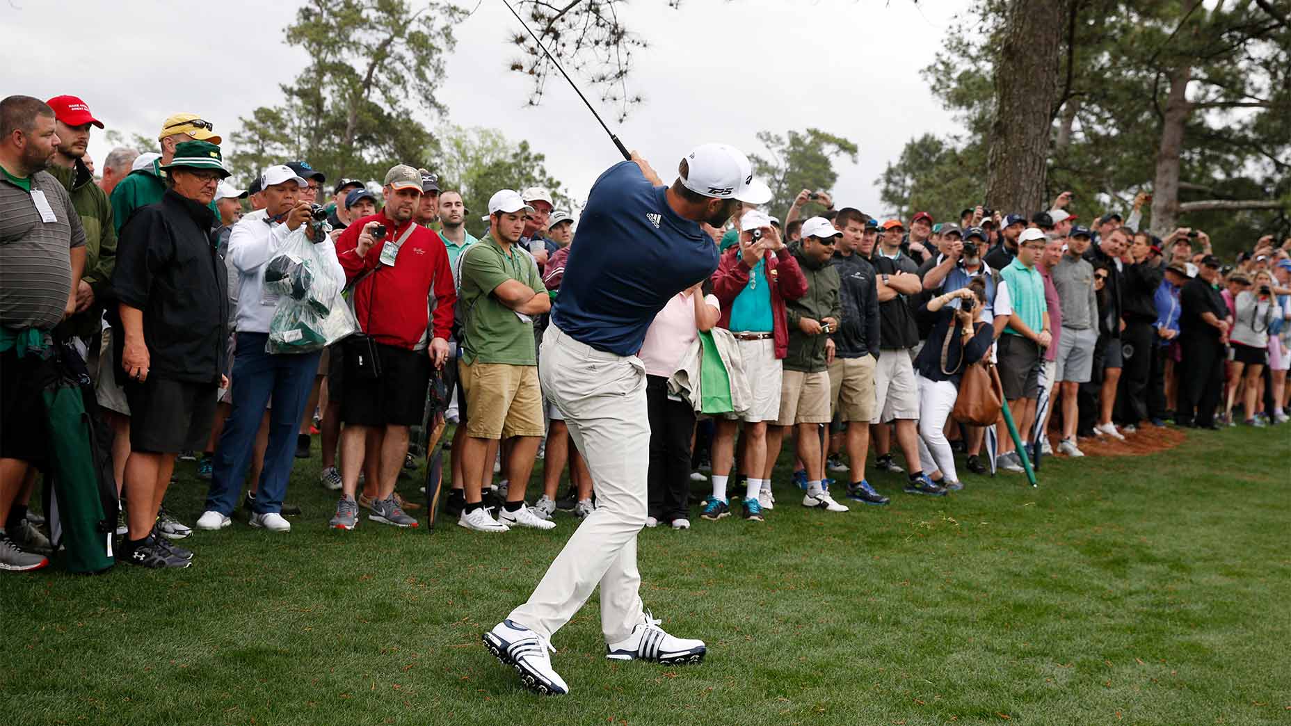 Dustin Johnson hits at the Masters.